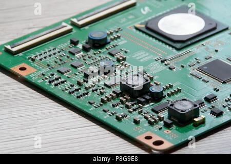 Close up photo of circuit board on wooden background Stock Photo