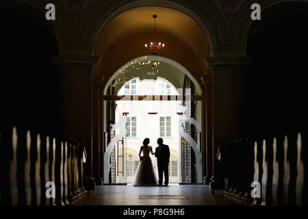 Bride walking down aisle with her father Stock Photo