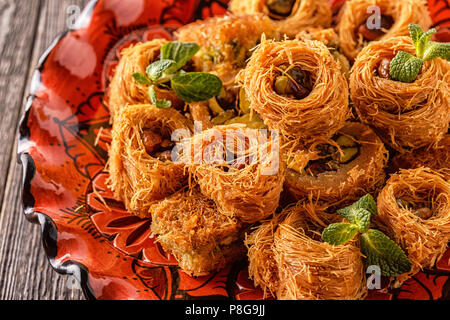 Eastern sweets on an old wooden table. Stock Photo