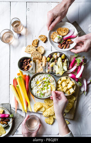 Onion Dip Platter with two people eating Stock Photo