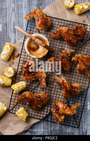 Fried Chicken wings with BBQ sauce and corn. Stock Photo