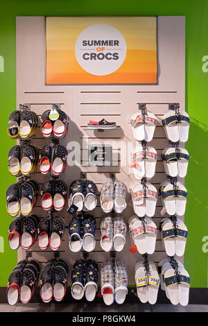 A display of Summer Crocs near the entrance to the Croc Store on West 34th Street in Manhattan, New York City. Stock Photo