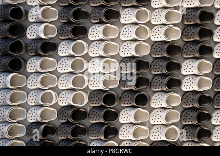 An abstract display of miniature Crocs at the entrance to the Croc