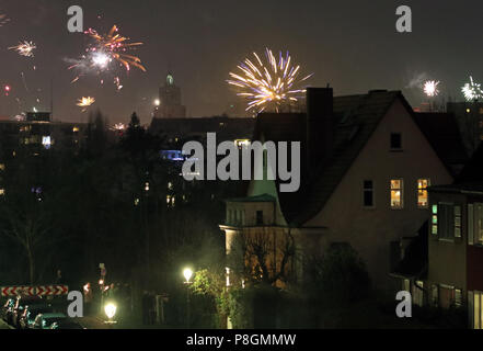 Berlin, Germany, New Year's Eve fireworks over a residential area Stock Photo