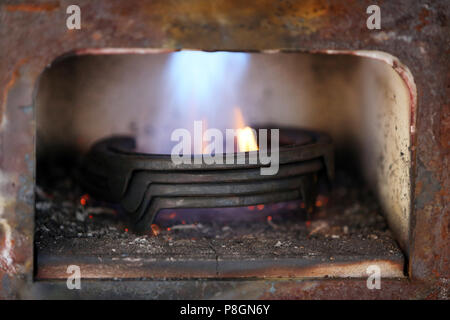 Neustadt (Dosse), horseshoes are heated in an oven Stock Photo