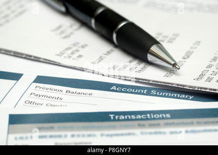 Pen On Top Of Receipts And Bank Statements Stock Photo