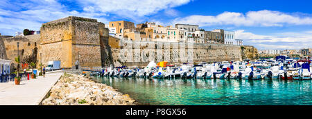 Beautiful Otranto town,view with traditional houses,boats and old castle,Puglia,Italy. Stock Photo