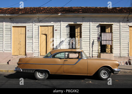 CIENFUEGOS, CUBA - FEBRUARY 3: Classic American car parked in the street on February 3, 2011 in Cienfuegos, Cuba. The multitude of oldtimer cars in Cu Stock Photo