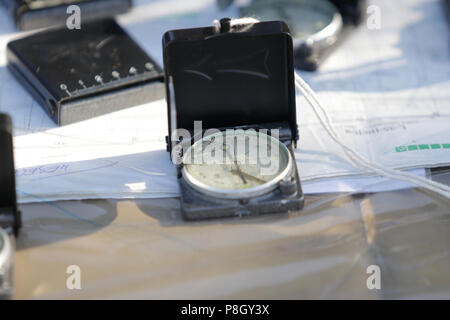 Compass and maps on the table Stock Photo