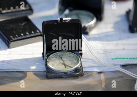Compass and maps on the table Stock Photo