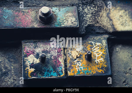 rusty screws and metal closeup in abandoned factory Stock Photo