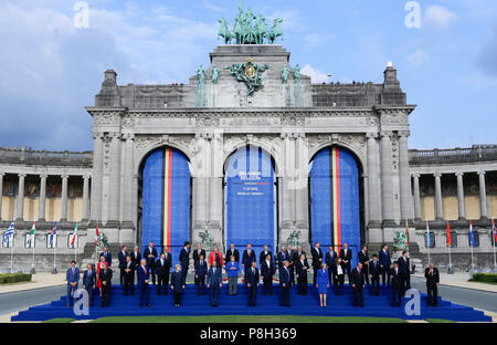 (180711) -- BRUSSELS, July 11, 2018 (Xinhua) -- NATO and partner countries' leaders pose for a family photo during the North Atlantic Treaty Organization (NATO) summit in Brussels, Belgium, on July 11, 2018. NATO leaders 'are committed to improving the balance of sharing the costs and responsibilities,' according to a summit declaration published on Wednesday. (Xinhua/Ye Pingfan) Stock Photo