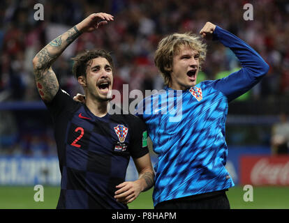Moscow, Russia. 11th July, 2018. Soccer, FIFA World Cup 2018, final round, semi-finals: Croatia vs England at Luzhniki Stadium: Croatia's Sime Vrsaljko (L) and Tin Jedvaj celebrate their team's entry into the finals after the match. Credit: Christian Charisius/dpa/Alamy Live News Stock Photo