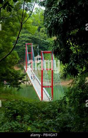 A Hanging bridge on Kaptai Lake in Rangamati. Kaptai Lake is a man; made lake in south; eastern Bangladesh. It is located in the Rangamati District of Stock Photo