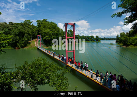 A Hanging bridge on Kaptai Lake in Rangamati. Kaptai Lake is a man; made lake in south; eastern Bangladesh. It is located in the Rangamati District of Stock Photo