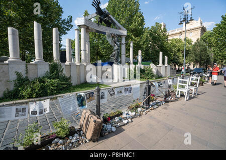 Protest signs in front of the German occupation memorial at the Szabadsad square in Budapest, Hungary Stock Photo