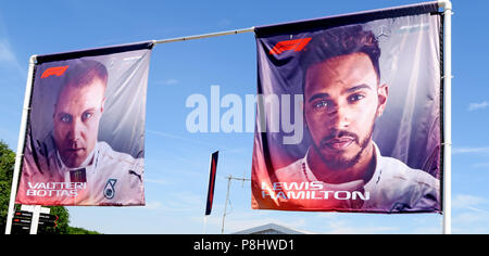 Lewis Hamilton and Valtteri Bottas images on flags, Silverstone circuit, Northampton, British Grand Prix 2018, England, UK Stock Photo