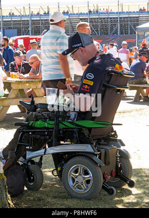 Disabled Red Bull fan spectator, at the British Grand Prix, Silverstone Circuit, Towcester, Northamptonshire, England, UK Stock Photo
