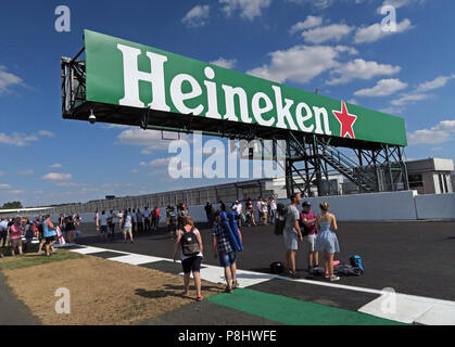Heineken Lager Beer advertising at The British Grand Prix, trackside, Silverstone, Silverstone Circuit, Towcester, Northampton, England, UK,  NN12 8TL Stock Photo