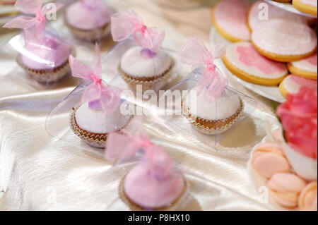 Delicious wedding cupcakes in pink and purple Stock Photo