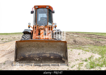 orange wheel loader on new construction site. front view Stock Photo