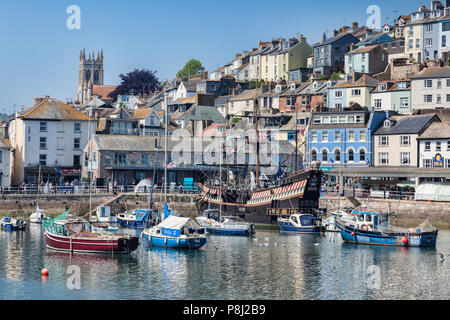 23 May 2018: Brixham, Devon, UK - The harbour with the replica Golden Hind on a fine spring day. Stock Photo