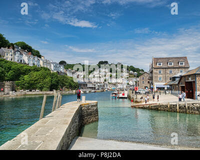 6 June 2018: Looe, Cornwall, UK - Jetty on the River Looe, and the town, on a beautiful spring day. Stock Photo