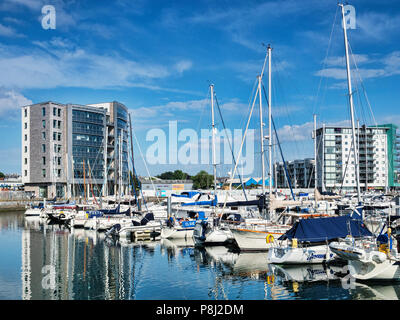 9 June 2018: Plymouth, Devon, UK - Sutton Pool, or Sutton Harbour, and apartments in the Barbican area of the city. Stock Photo