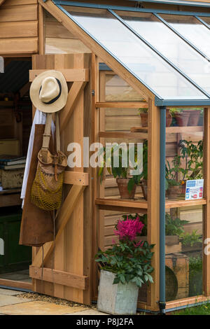 Timber greenhouse & potting shed, on display & for sale on Gabriel Ash trade stand  - RHS Chatsworth Flower Show, Derbyshire, England, UK. Stock Photo