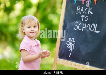 Adorable little girl feeling excited about going to preschool for the first time Stock Photo