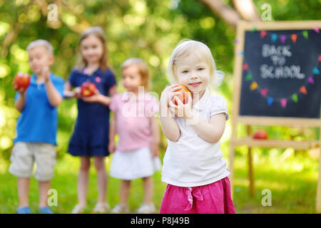 Adorable little girl feeling excited about going to preschool for the first time Stock Photo