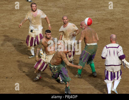 Calcio fiorentino, an early form of football that originated in 16th-century Italy, on the Piazza Santa Croce in Florence Italy.  Featuring: atmosphere Where: Florence, Tuscany, Italy When: 10 Jun 2018 Credit: IPA/WENN.com  **Only available for publication in UK, USA, Germany, Austria, Switzerland** Stock Photo