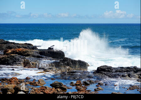 Ocean waves crashing on rocks, Kauai, Hawaii Stock Photo