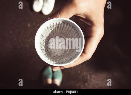 glass of water in a woman's hand Stock Photo