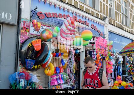 sunset rock shop selling beach plastic items margate kent uk Stock Photo