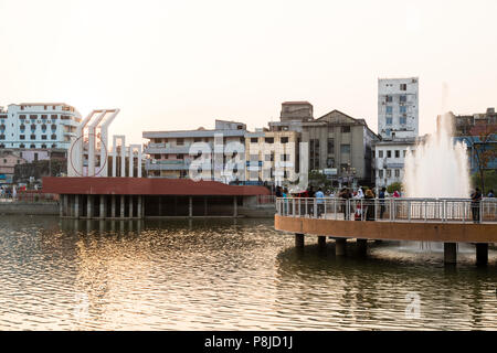 Khulna, Bangladesh, February 28 2017: City center with park and pond in Khulna in the evening light Stock Photo