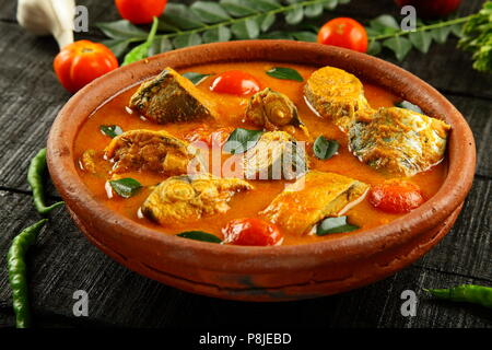 Seafood ,fish curry cooked in clay pot, with exotic herbs and spices, Indian recipes. Stock Photo