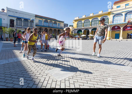 School children in for races in Plaza Vieja in old Havana, Cuba Stock Photo