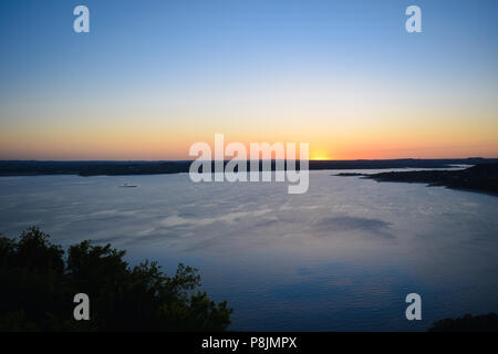 A stunning sunset over Lake Travis in the hill country of Central Texas near Austin. Stock Photo