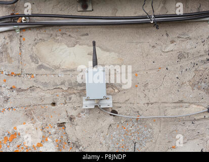 small transmitter or receiver for frequency on the wall Stock Photo