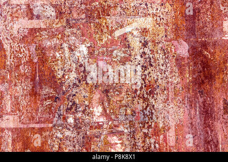 Red colored metal with cracked paint, grunge background Stock Photo