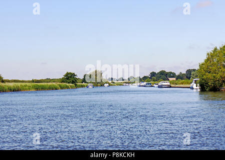 Boats moored on the River Bure on the Norfolk Broads near St Benet's Abbey, Horning, Norfolk, England, United Kingdom, Europe. Stock Photo