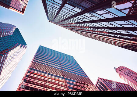 Looking up at Manhattan skyscrapers at sunset, New York City, USA. Stock Photo