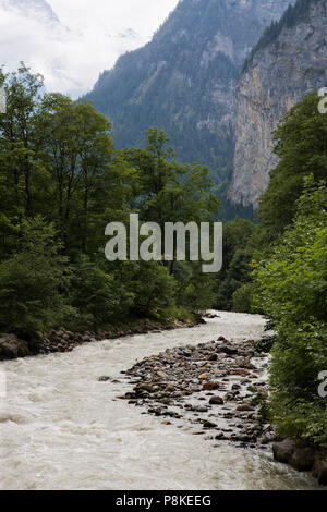 Weisse Lütschine: fast-flowing glacier meltwater river in the upper Lauterbrunnen Valley near Stechelberg, Bernese Oberland, Switzerland Stock Photo