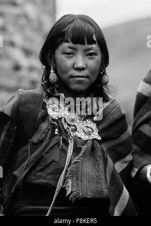 A NEPALI GIRL wearing DOLPO BLANKET and dorje shaped SILVER CLASP at the upper DO TARAP VALLEY FESTIVAL - DOLPO, NEPAL Stock Photo