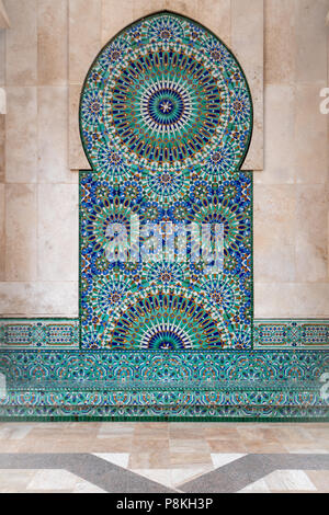 Intricate geometric symmetrical tiled pattern on the exterior wall of Mosque Hassan II in Casablanca, Morocco Stock Photo