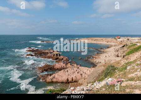 Coastline of El Hank - southern district of Casablanca, Morocco  - with boys and men enjoying the sun and sea Stock Photo