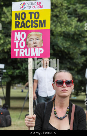 Regent's Park London, 12th July 2018. Demonstrators are protesting against US President Donald Trump's visit to London at Hanover Gate, close to Winfield House, the US ambassador's residence where Trump is expected to spend some time today. Credit: Imageplotter News and Sports/Alamy Live News Stock Photo