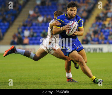 Joe Philbin of Warrington Wolves makes a break during the Betfred Super ...