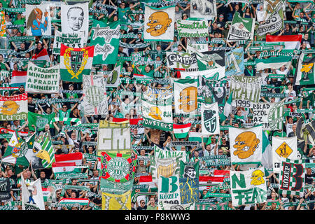 Budapest, Hungary. 12th July, 2018. The ultra fans (called Green Monsters) lift up flags and banners prior to the UEFA Europa League First Qualifying Round 1st Leg match between Ferencvarosi TC and Maccabi Tel Aviv FC at Groupama Arena on July 12, 2018 in Budapest, Hungary. Credit: Laszlo Szirtesi/Alamy Live News Stock Photo